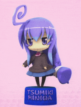 a figurine of a girl with purple hair and a swirl in her hair