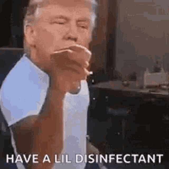 donald trump is smoking a cigarette and giving a thumbs up .