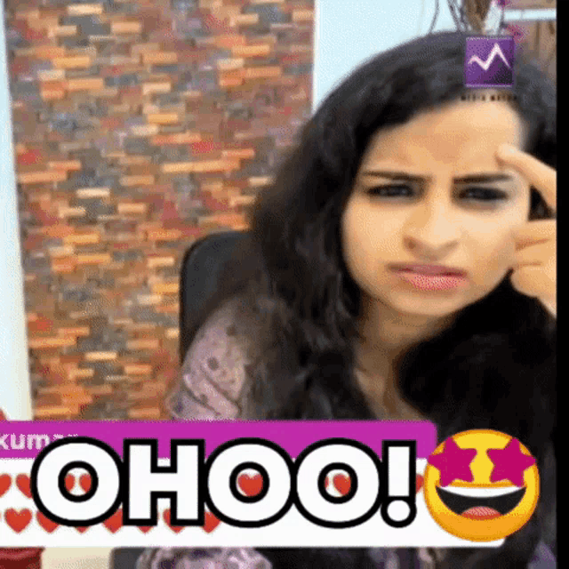 a woman 's face is behind a sign that says ' ohoo '