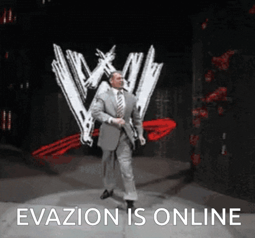a man in a suit and tie is walking on a stage in front of a wwe logo ..