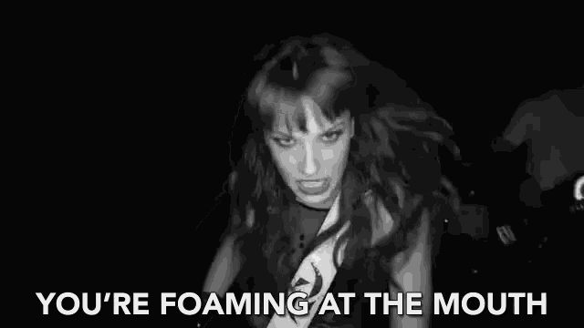 a black and white photo of a woman with the words " you 're foaming at the mouth "