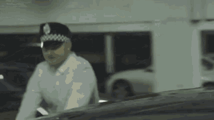 a man in a parking garage with the words brisim achan riail on the bottom
