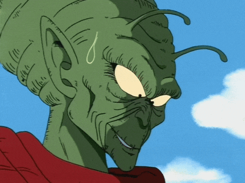 a close up of a cartoon character with a red shirt on