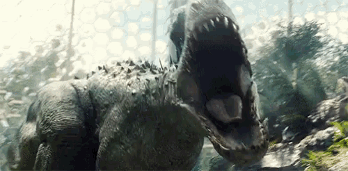 a close up of a dinosaur with its mouth open and its tongue out .