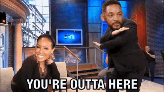 a man and a woman are on a show and the man is saying you 're outta here