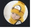 a baby wearing a yellow knitted hat with a penguin on it .