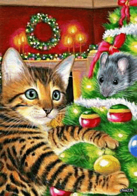 a cat and a mouse decorate a christmas tree