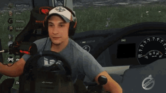 a man playing a video game in a volvo