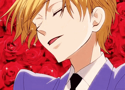 a close up of a person 's face with their eyes closed in front of red roses