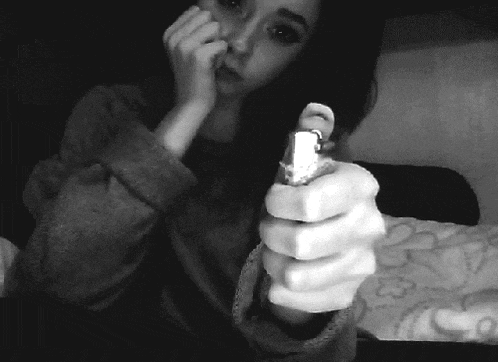 a woman is holding a light bulb in her hand