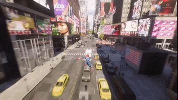 an aerial view of a city street with a billboard for xco sports in the background