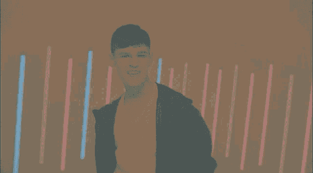 a man in a white shirt is dancing in front of a blue background