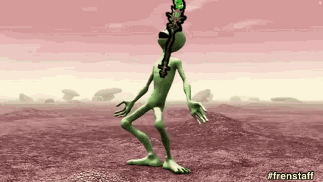 a green cartoon character is holding a sword in his mouth