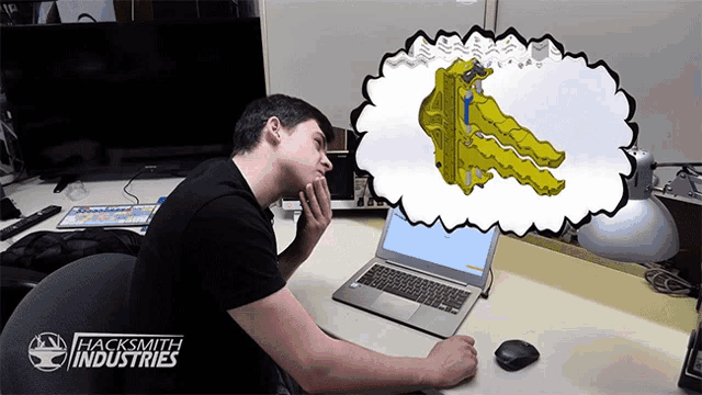 a man sitting in front of a laptop with a speech bubble that says hacksmith industries