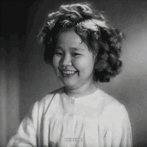 a black and white photo of a little girl with the caption ho-ho-ho