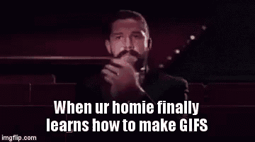 a man in a tuxedo with a beard is making a funny gif .