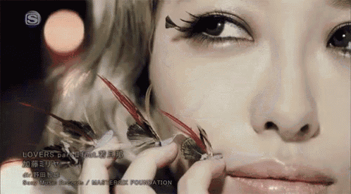 a close up of a woman 's face with the word lovers on the bottom