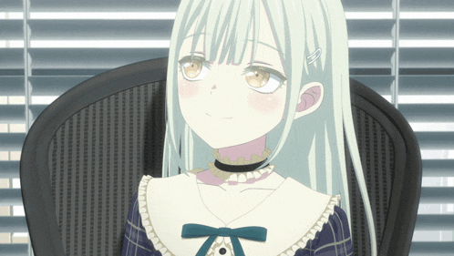 a girl with white hair is sitting in a chair in front of blinds