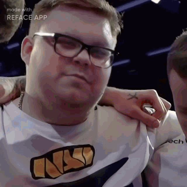 a man with glasses and a shirt that says nsp