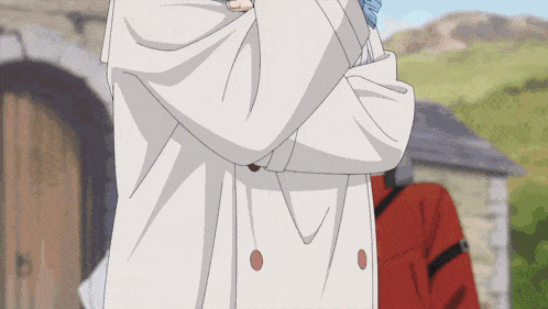 a person wearing a white coat with red buttons