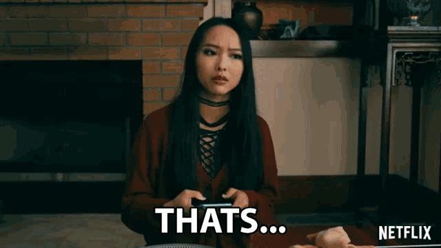 a woman is playing a video game and saying that 's ... netflix