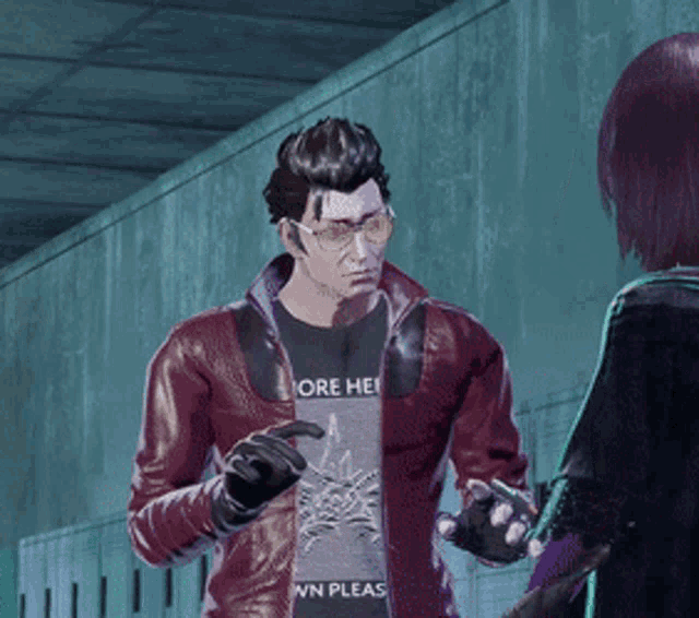 a man wearing a t-shirt that says more hell talks to a woman