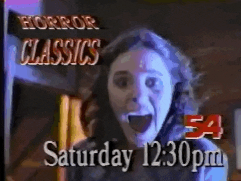a woman is screaming in front of a sign that says horror classics on it