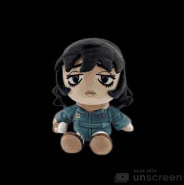 a stuffed doll is made with unscreen and is sitting on a black background