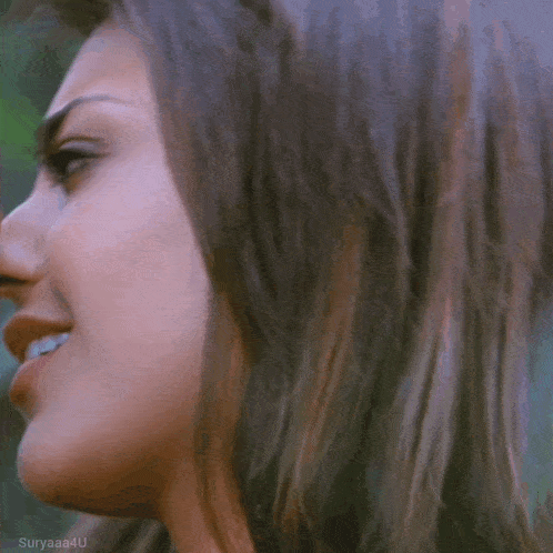 a close up of a woman 's face with a man 's nose .