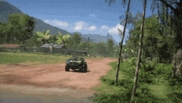 a green buggy is driving down a dirt road surrounded by trees