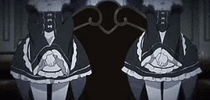 two maids are sitting next to each other in a dark room .