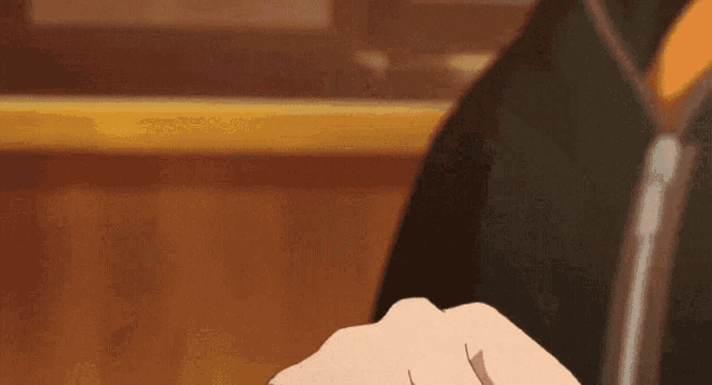 a close up of a person 's fist in a cartoon
