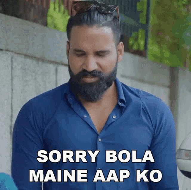 a man with a beard wearing sunglasses says sorry bola maine aap ko