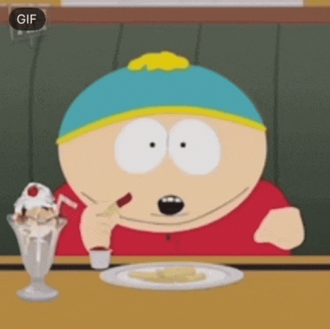 a cartoon character from south park is sitting at a table eating a cheesecake .