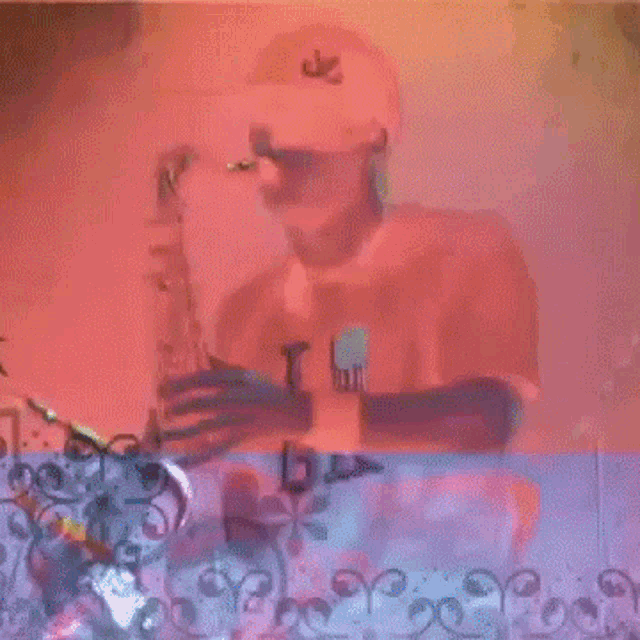 a man is playing a saxophone in front of a crowd