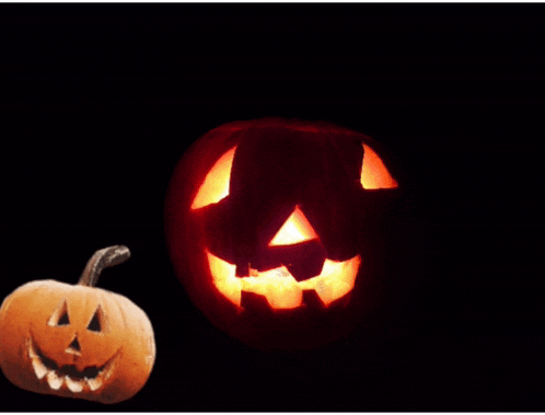 a carved halloween pumpkin with a glowing face