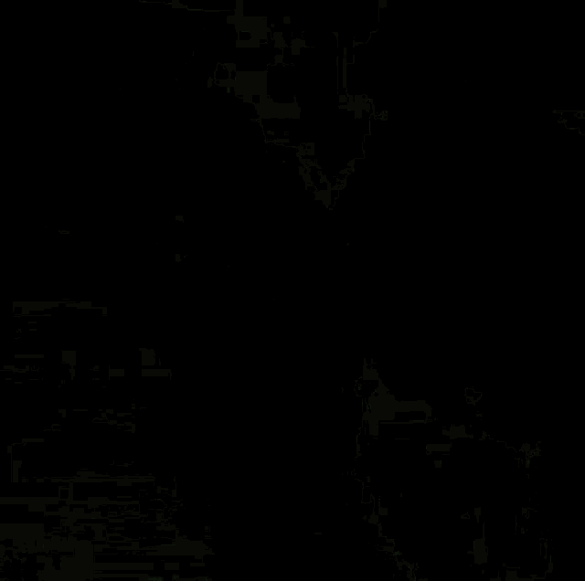 a pixelated image of a dark background with red and green spots