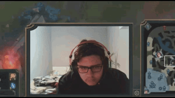 a man wearing glasses and headphones is looking at the camera