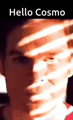 a close up of a man 's face with the words hello cosmo on the top
