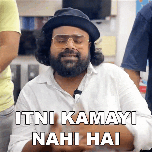 a man with a beard wearing a hat and sunglasses says itni kamayi nahi hai