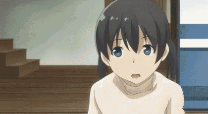 a girl with black hair and blue eyes is wearing a white sweater and looking at the camera .