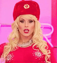a woman wearing a red hat and a red dress