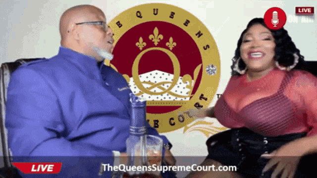 a man and woman are sitting in front of a supreme court logo