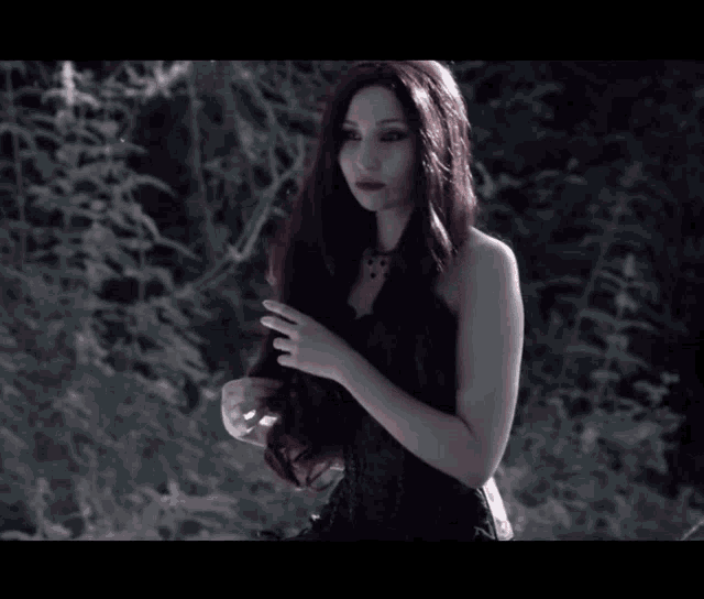 a woman with long red hair and a black dress