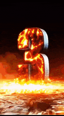 the number 3 is surrounded by flames on a dark background
