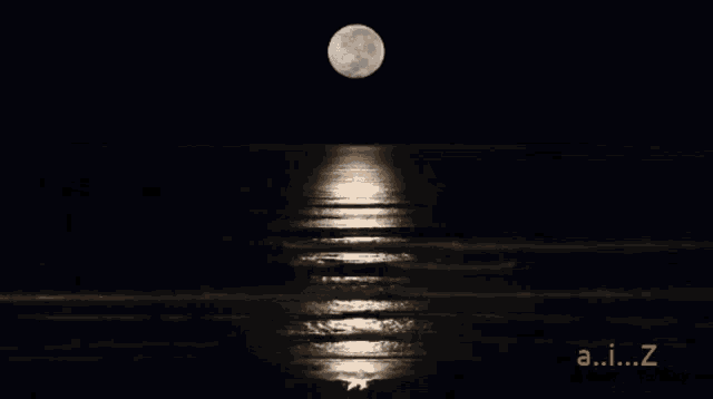 a picture of a full moon over the ocean with the letters a.i.z visible