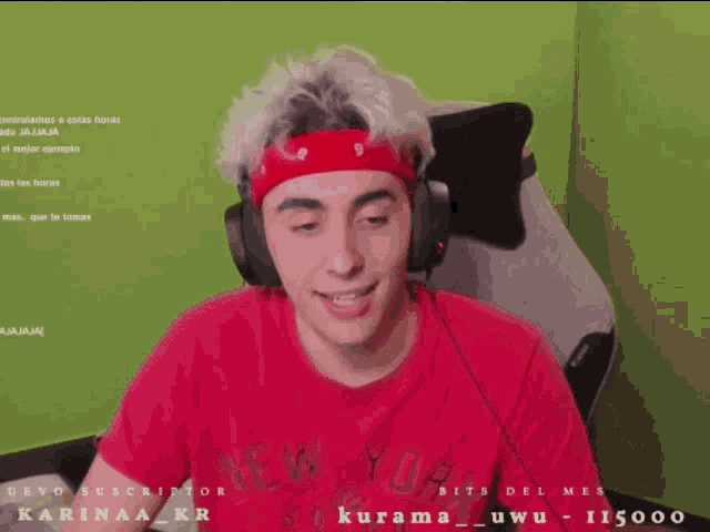 a man wearing headphones and a red shirt with the word new york on it