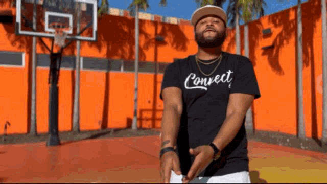 a man wearing a black t-shirt that says connect