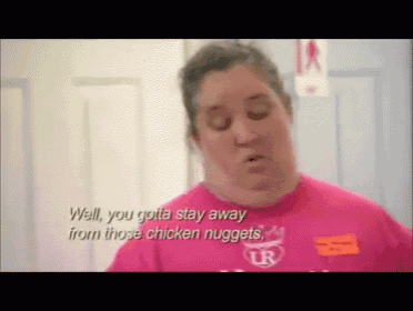 a woman in a pink shirt is talking about chicken nuggets