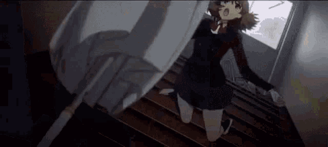 a girl in a school uniform is kneeling down on the stairs .